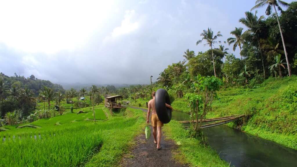 Walking next to Babahan Crystal Water carrying the tube