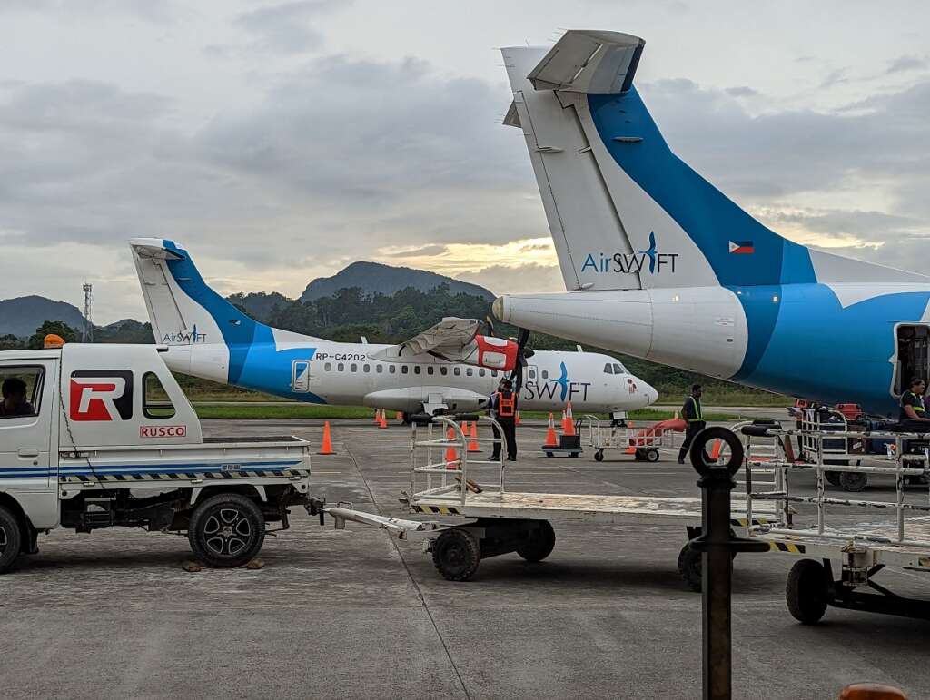 Disembarking from AirSwift ATR72 and view to the runway at El Nido airport.