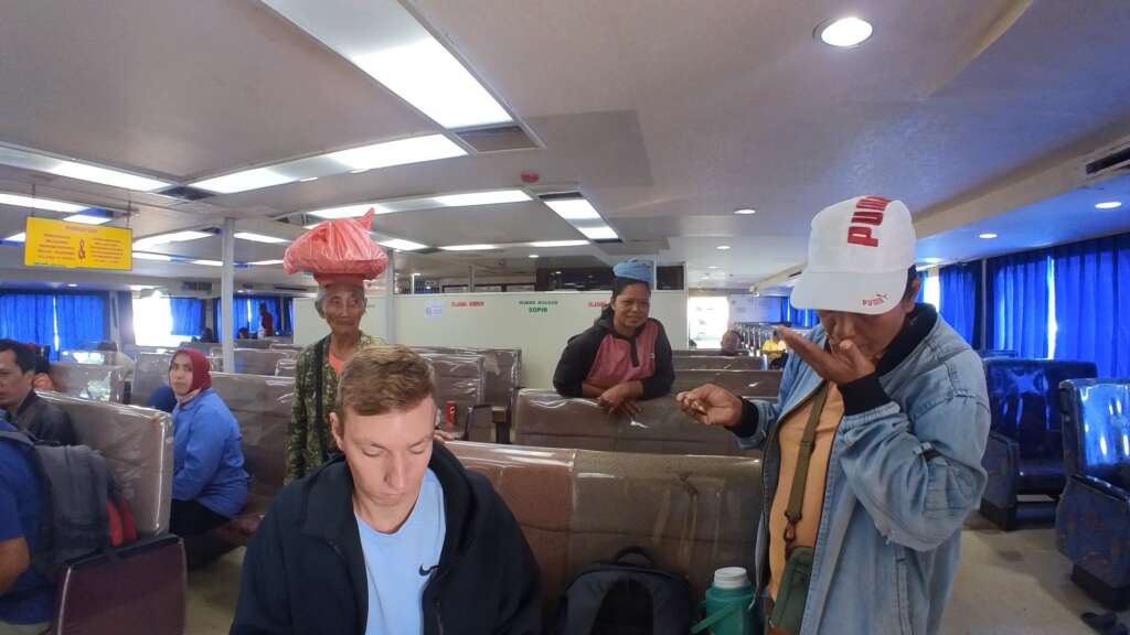 Indoor area. Locals are selling food and drinks on the ferry