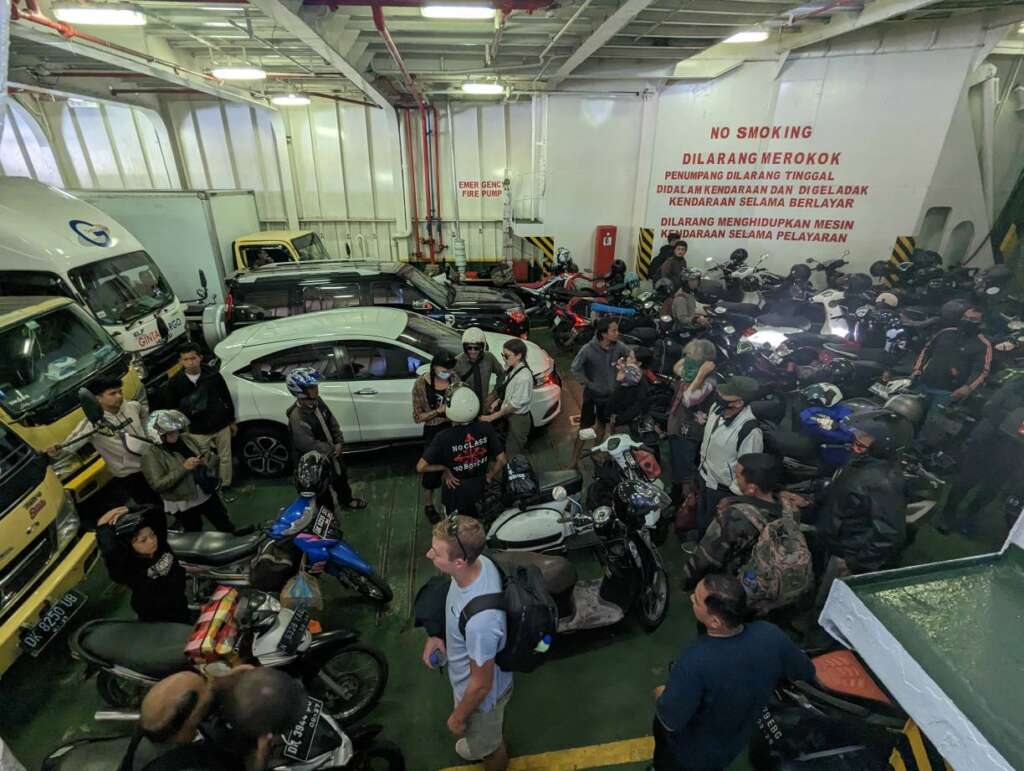 Inside the ferry. Cars and scooters side by side