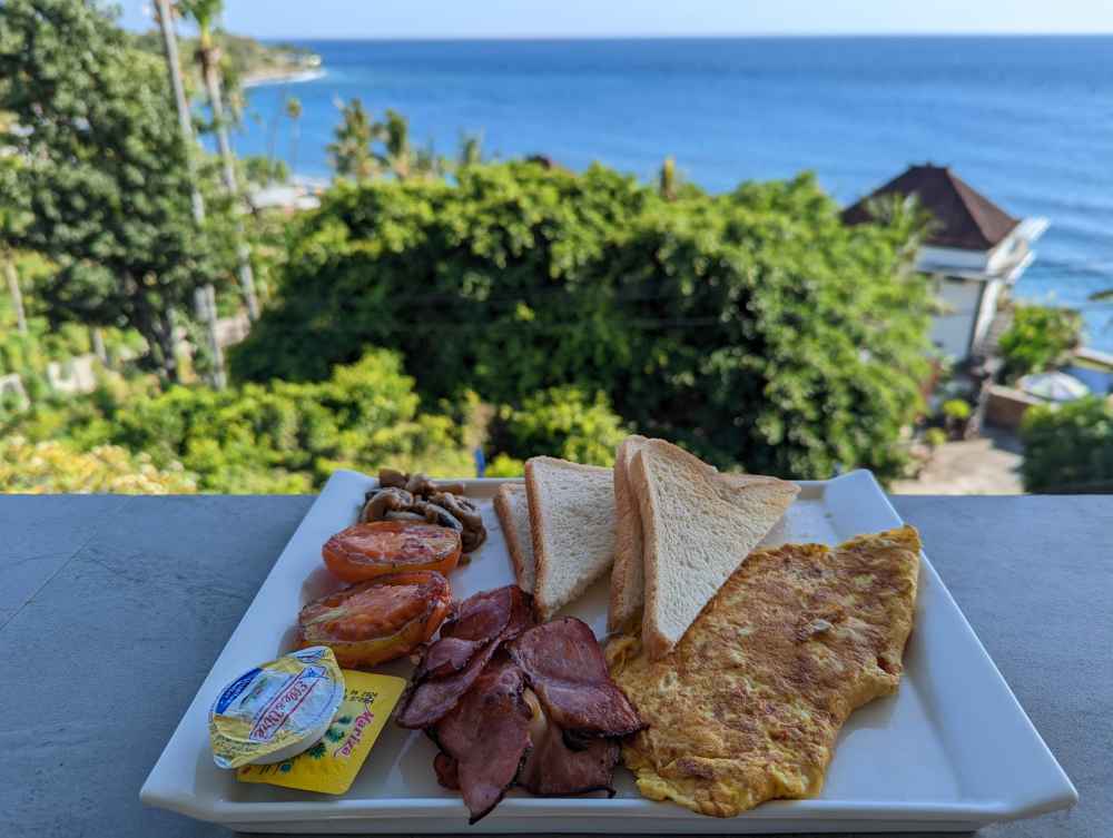 Gusto Resto & Cafe breakfast. Omelete and bacon.